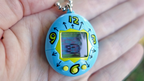 The Tamagotchi’s low-res screen is cute, but hindered by a reflective cover on the screen that reflects everything.